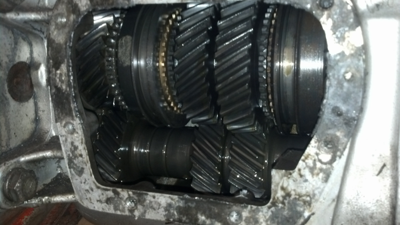 The two grooves match up with two grooves on the input shaft to help the guy on the assembly line get the right gear set - in this case, wide ratio.
